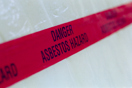 Asbestos tape across plastic containment area.